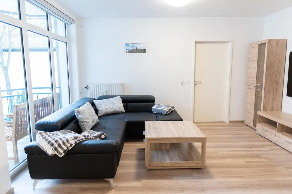 Corner sofa with cushions and blanket